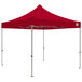 A red Caravan Canopy instant tent with poles.