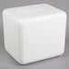 A white foam cube with a lid on it.