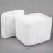 A white foam container with a lid on it.