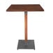 A Lancaster Table & Seating square wooden table with a metal base.