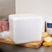 A white Nordic insulated polystyrene cooler on a table.