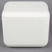 A white foam cube with a lid on it.