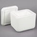 A white foam container with a lid.