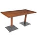 A Lancaster Table & Seating wooden table with a metal base.