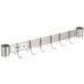 A stainless steel leg mounted pot rack with hooks on it.