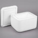 A white styrofoam box with a lid.