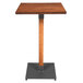 A Lancaster Table & Seating square wooden bar table with a wooden stand and metal base.