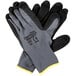 A pair of Cordova black and gray grip gloves with black sandy nitrile palms.