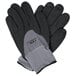 A pair of gray and black Cordova Conquest Max gloves with black and gray hand coating and nitrile dots.