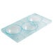 A clear plastic container with three circles.