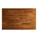 A rectangular solid wood table top with a rustic walnut finish.