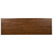 A brown rectangular wood table with a live edge top.