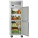 A Traulsen reach-in refrigerator with right hinged doors full of food.