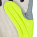 A close up of a Cordova Colossus IV Hi-Vis lime glove with canvas palm coating.