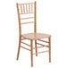 A Flash Furniture Hercules Natural Wood Chiavari Stacking Chair.