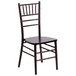 A Flash Furniture walnut chiavari stacking chair.