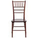 A Flash Furniture Hercules Fruitwood Chiavari stacking chair with a wooden seat.