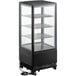 An Avantco black glass sided countertop display refrigerator with shelves.