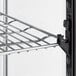 An Avantco countertop display refrigerator metal shelf with wire rack.