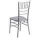 A Flash Furniture silver Chiavari chair with a backrest.
