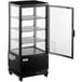 An Avantco black glass countertop display refrigerator with glass doors.