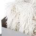 A Campus Products GP8 Stemshine electric glass polisher with eight white fluffy yarn mops in a metal box.
