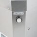 A Campus Products GP8 Stemshine electric glass polisher with a button on it.