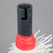 A Campus Products GP8BRUSHKIT polishing head with red and black bands on a metal pole.