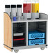 A Lakeside serving cart with containers of liquid on a shelf.