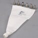 A white bag with five metal Ateco piping tips.