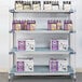 A MetroMax shelving unit with boxes and bottles of beer on it.