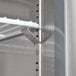 A metal shelf with white rods.