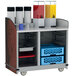 A Lakeside serving cart filled with a variety of beverages and a basket.