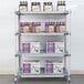 A MetroMax shelving unit with boxes and bottles of beer on the shelves.