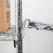 A Metro Super Erecta chrome wire shelf with a box on it.