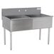 An Advance Tabco stainless steel sink with two compartments on a counter.