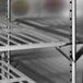 A close-up of a stainless steel shelf inside a Beverage-Air undercounter refrigerator.