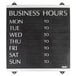 A black Headline Sign business hours sign with white text on a white background.