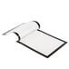 A black DURAFRAME sign holder with a white and black paper with a curved edge inside.