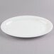 A Fineline white plastic oval catering tray with a rim.