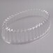 A clear plastic container with an oval design and a pointed edge.