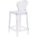 A clear plastic counter height stool with a clear tear back.