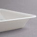 A white Fineline rectangular plastic catering tray with a lid.