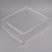 A clear plastic container with a clear plastic square dome lid.