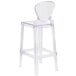 A clear plastic bar stool with a tear back.