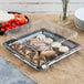 A Fineline clear plastic square dome lid on a tray of vegetables with dip.