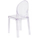 A Flash Furniture clear polycarbonate chair with an oval back.