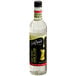 A close up of a DaVinci Gourmet Classic Cane Sugar Flavoring Syrup bottle with a black cap.