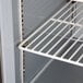 A white wire shelf inside a Beverage-Air sandwich prep refrigerator.