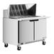 A white Beverage-Air commercial refrigerator on wheels with a stainless steel exterior and mega top sandwich prep table.
